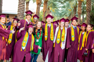 Starbucks partners posing after graduation