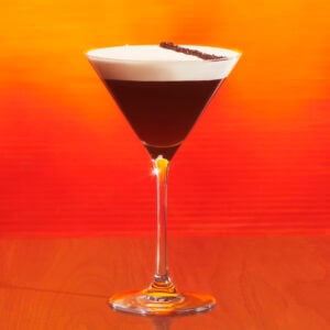 Starbucks hot honey espresso martini on an orange background