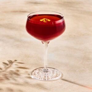 Starbucks Reserve Sakura Blossom Negroni in a glass with a with red color