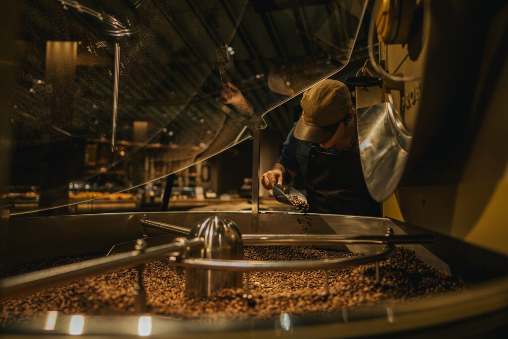 Master roaster looking at the coffee being roasted