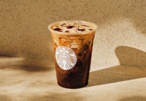 Starbucks Iced Shaken Oatmilk Espresso on a beige background