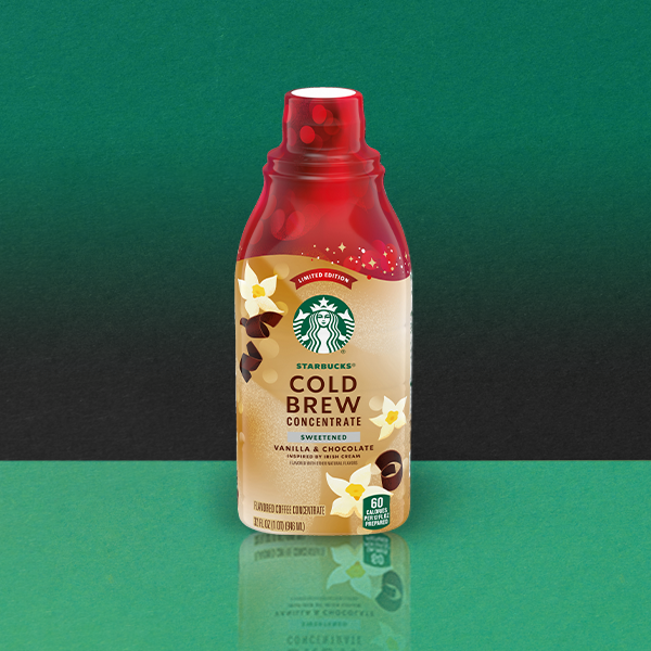 A bottle of Starbucks Cold Brew Concentrate in a sweetened vanilla and chocolate flavor. The design features floral accents and coffee beans.