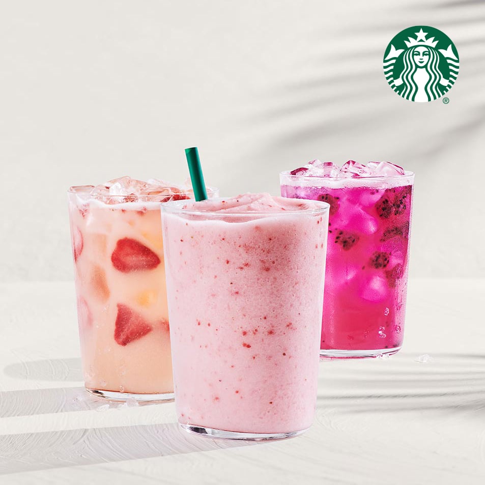 Three colorful drinks are displayed: a pink smoothie with a green straw, a peach drink with strawberry pieces, and a vibrant purple beverage with ice.